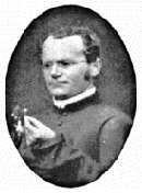 Gregor Mendel se snítkou fuchsie, okolo roku 1862.